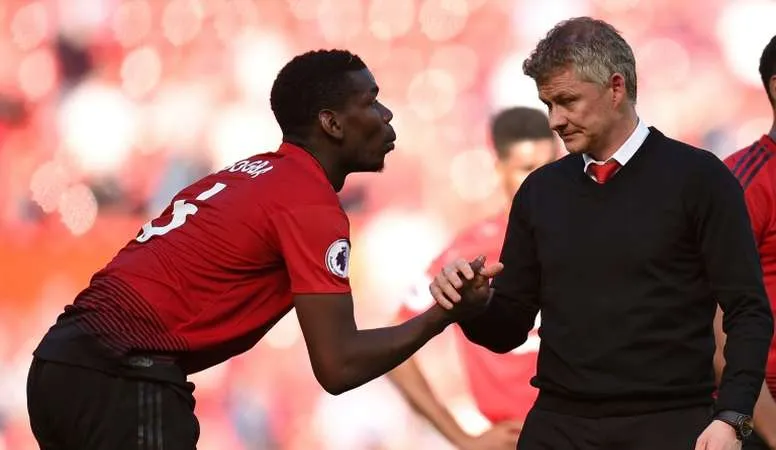 Paul Pogba và HLV Ole Gunner Solskjaer.