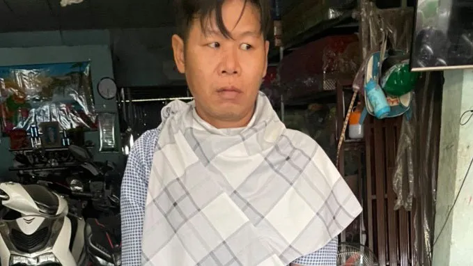 Đối tượng Tho lúc bị bắt. Ảnh: CHÍ THẠCH 