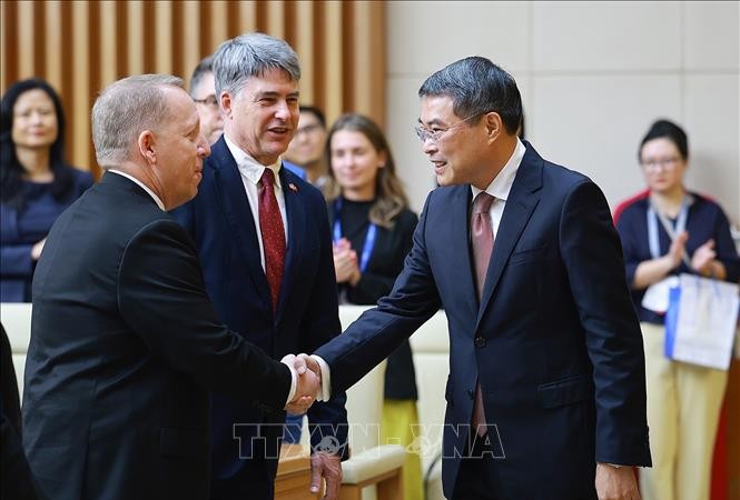 政府总理黎明兴会见并与美国-东盟商务理事会高级企业代表团举行工作会议。图：杨江/越通社