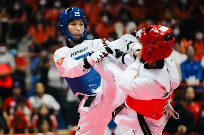 Kim Tuyền (xanh) sẽ có nhiều cơ hội được dự vòng loại Olympic tại Trung Quốc sắp tới. Ảnh: DŨNG PHƯƠNG