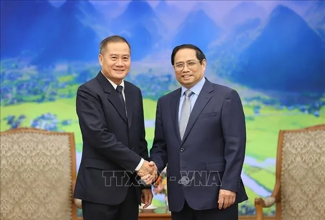 Thủ tướng Phạm Minh Chính tiếp Tổng Giám đốc Thông tấn xã Pathet Lào (KPL) Khampheuy Philapha. Ảnh: TTXVN