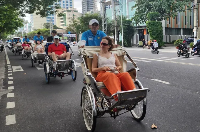 Tourists explore Nha Trang by cyclo. (Photo: SGGP)