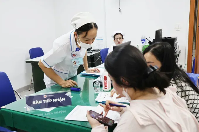 Doctors at An Binh Hospital welcome residents for health checkups.