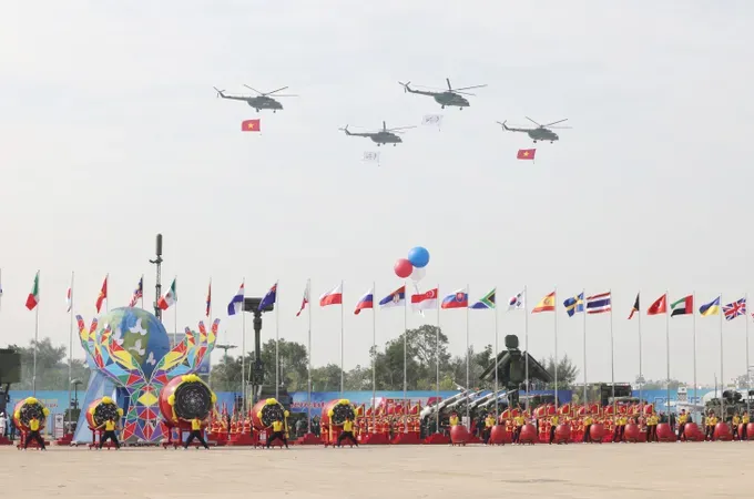 Helicopters perform a flypast at the opening ceremony of the Vietnam Defence Expo 2024. (Photo: SGGP)