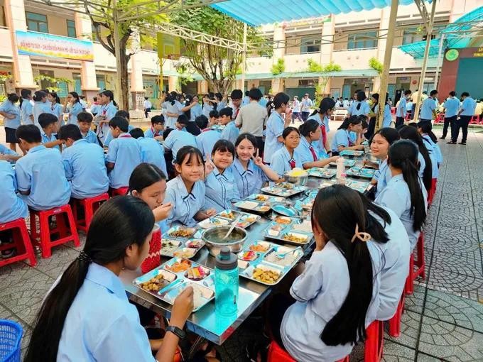 Students at Ho Van Long Junior High School in Binh Tan Ward during their lunch break