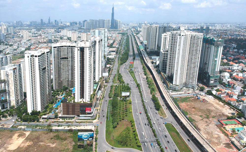 Apartment buildings on both sides of Line 1 crossing Hanoi highway