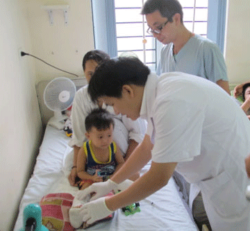 Doctors checking the child's severed foot before discharging him Doctors checking the child's severed foot before discharging him
