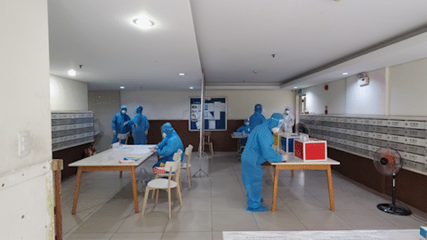 Residents of the locked-down Sunview Town apartment building