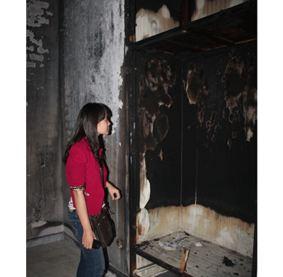 A charred house destroyed by fire generated by the girl’s unique powers