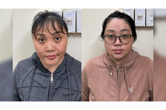 Lợi và Chi (từ trái qua phải) tại cơ quan công an.