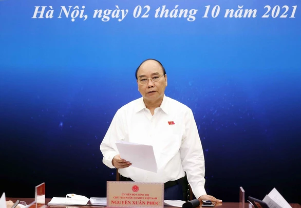 Chủ tịch nước Nguyễn Xuân Phúc: Sẽ có chính sách cụ thể hỗ trợ cho doanh nghiệp trong giai đoạn khó khăn hiện nay về tài chính, tiền tệ. Ảnh: TT 