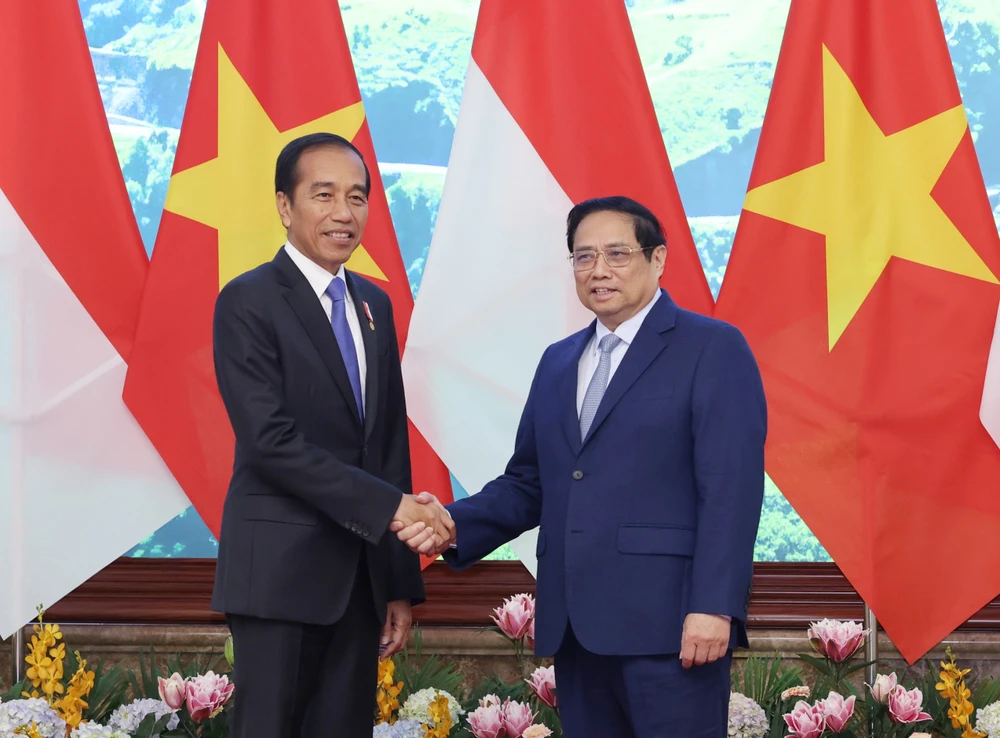 Thủ tướng Phạm Minh Chính và Tổng thống Indonesia Joko Widodo. Ảnh: VIẾT CHUNG