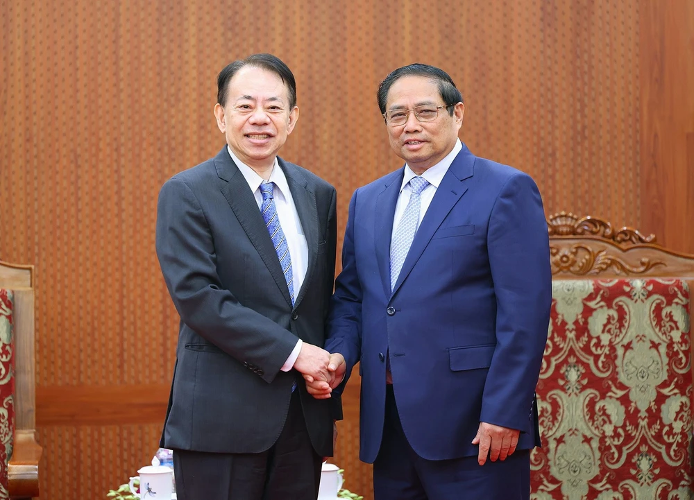 Thủ tướng Phạm Minh Chính tiếp Chủ tịch Ngân hàng Phát triển châu Á (ADB) Masatsugu Asakawa, chiều 13-3. Ảnh: VIẾT CHUNG