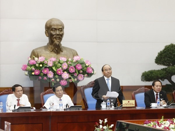 ​ Prime Minister Nguyen Xuan Phuc speaks at a meeting with leaders of press agencies on June 18 (Photo: VNA)