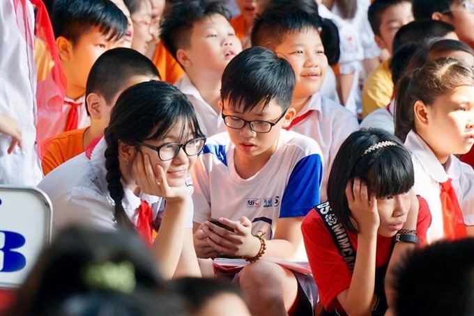 Students at Trung Trac Primary School in Hanoi. Hundreds of parents have joined lucky draws to get a place for their kids at State-owned pre-schools, especially in Hanoi’s new urban areas, due to the severe shortage of public facilities there. (Photo: VNA