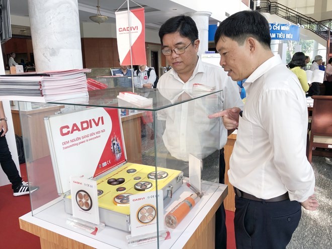 Products are showcased at the conference reviewing the campaign “Vietnamese use Vietnamese goods” in HCM City on April 13 (Photo: VNA)
