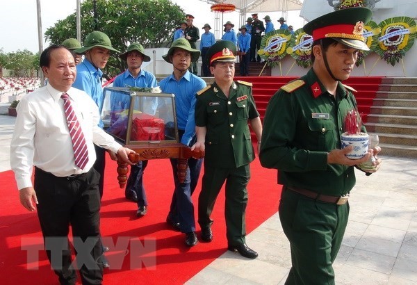 Quang Binh holds reburial service for remains of martyrs