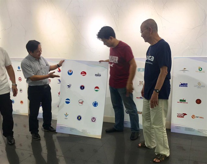 Getting ready: Organisers and logo designers are preparing for the Logo Việt Nam 2018 exhibition. — Photo courtesy of the organisers’ board
