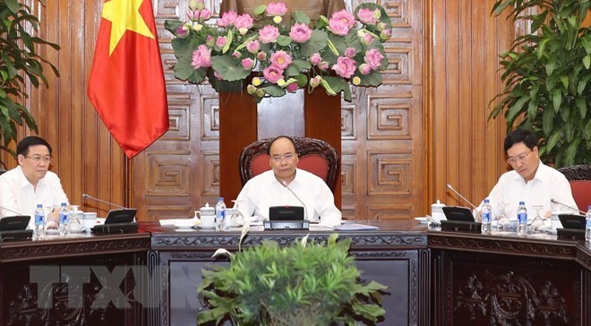 PM Nguyen Xuan Phuc orders stricter measures to prevent massive scrap imports. (Photo: VNA)