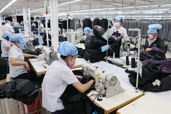 Workers at Da Nang city's 29/3 Textiles Company. Vietnam’s textile industry is expected to take advantage of the CPTPP agreement in 2019. (Photo: VNA)