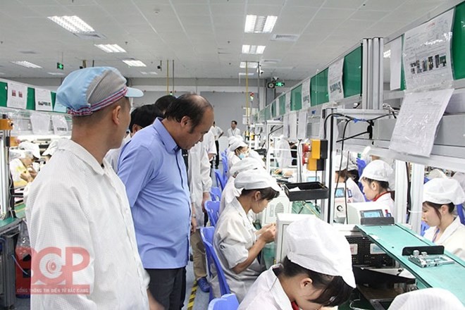 Workers at the New Wing Interconnect Technology Co. (Photo: bacgiang-iza.gov.vn)