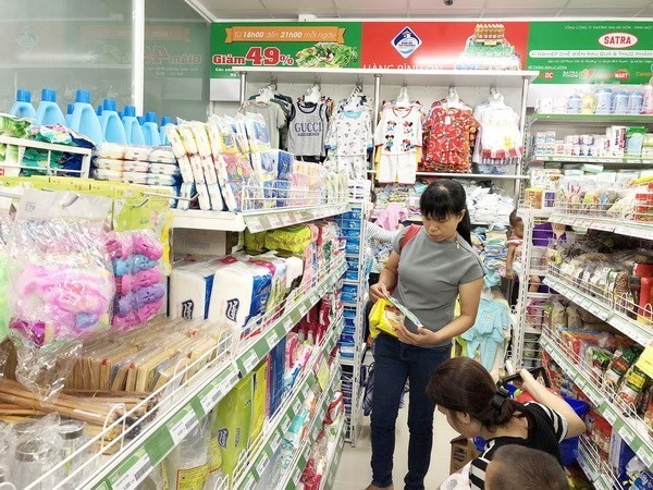 Consumers shop at a convenience store in HCM City (Photo: VNA)