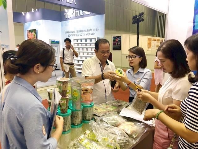 Visitors look at processed farm produce on display at the Vietnam International Exhibition on Processing, Packaging and Preserving Food and Agricultural Products held in HCM City. (Source: VNA)