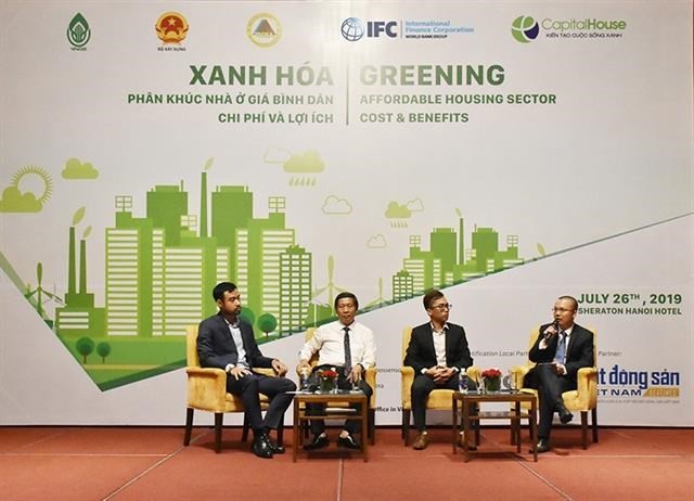 Experts and real estate developers discuss the development of affordable green housing in Vietnam. (Photo: VNA)