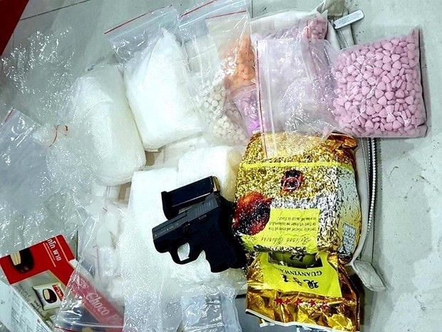 The drugs and weapon seized from the ring recently uncovered in HCM City (Source: VNA)