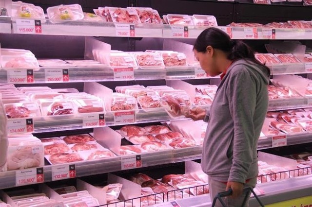 Pork products on shelves. The Ministry of Industry and Trade has founded a group to inspect the pork market to figure out problems that caused failures in cooling domestic pork prices. — VNA/VNS Photo