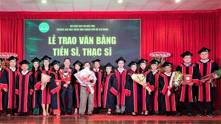 New masters and doctors of HCMC Nong Lam University receiving their degrees on October 31