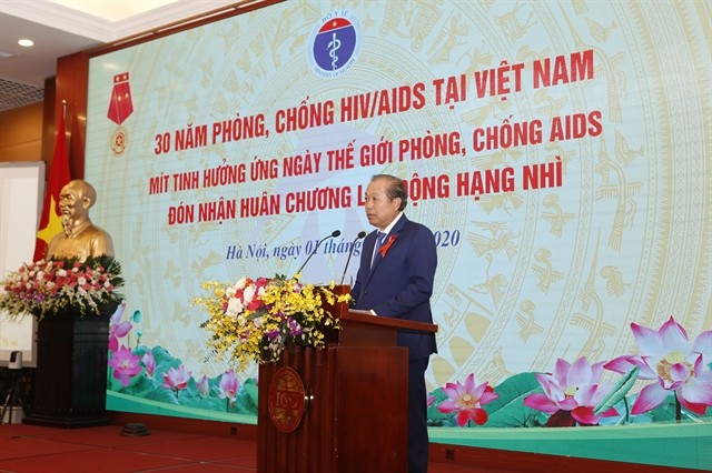 Permanent Deputy Prime Minister Truong Hoa Binhspeaks at a meeting to mark the World AIDS Day 2020 (December 1) and review 30 years of HIV/AIDS prevention and control in Vietnam on Tuesday. —Photo Ministry of Health