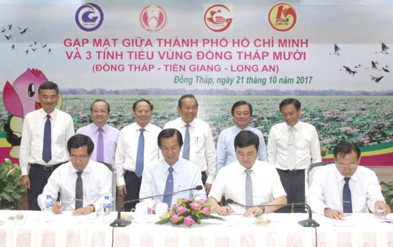 A meeting to economic cooperation and development between Dong Thap, Long An and Tien Giang with Ho Chi Minh City.