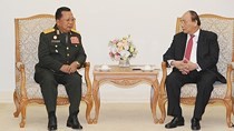 Vietnamese Prime Minister Nguyen Xuan Phuc (R) and Chansamone Channhalat, Politburo member, Defense Minister of the Lao People's Revolutionary Party