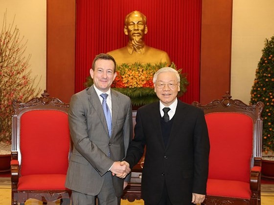 General Secretary of the Communist Party of Vietnam Nguyen Phu Trong (R) and French Ambassador to Vietnam Bertrand Lortholary