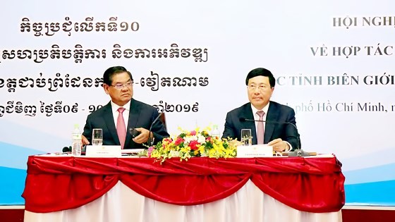 Deputy Prime Minister cum Minister of Foreign Affairs of Vietnam Pham Binh Minh and Deputy Prime Minister cum Interior Minister of the Kingdom of Cambodia Sar Kheng