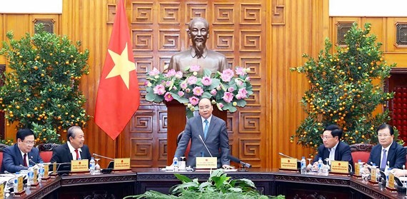 Prime Minister Nguyen Xuan Phuc (standing) speaks at the meeting of the Government standing board (Photo: SGGP)