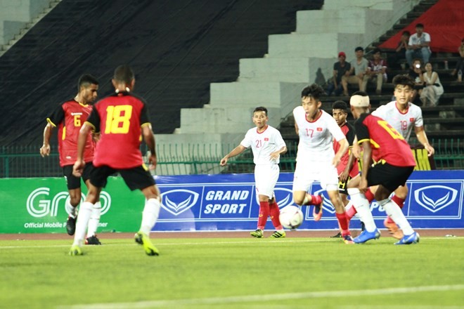 Vietnamese players (in white) in action (Photo: VNA)