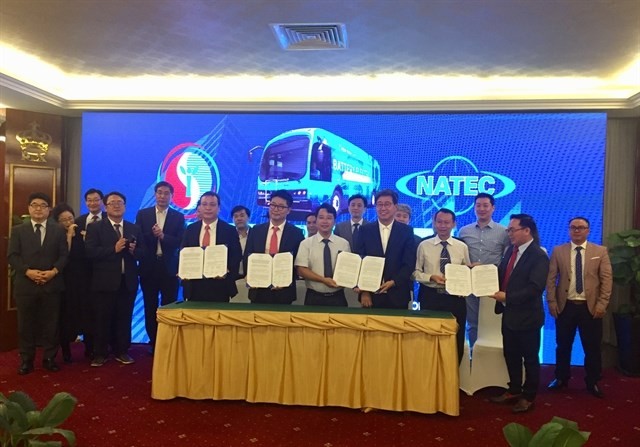 Agreements were signed between multiple parties in HCM City yesterday for setting up an electric bus rapid transit system (Photo: VNA)