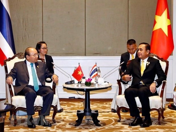 Vietnamese Prime Minister Nguyen Xuan Phuc (L) and Thai Prime Minister Prayut Chan-o-cha (Photo: VNA)