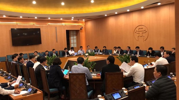 The People's Committee of Hanoi holds an urgent meeting on March 6 night after receiving reports on the new COVID-19 case (Photo: VNA) 