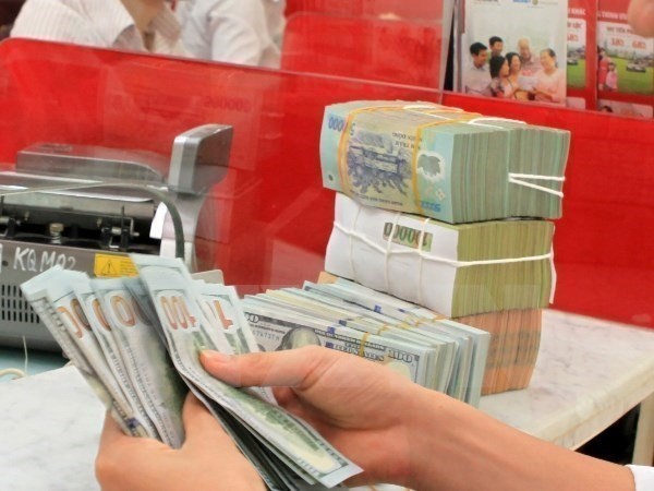 The State Bank of Vietnam sets the daily reference exchange rate at VND/US$23,208 VND on August 27 (Source: VNA)