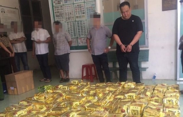 Drug trafickers are arrested by HCM City police force. (Photo: VNA)