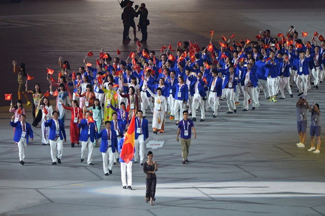 上屆越南體育代表團在開幕儀式上遊行。