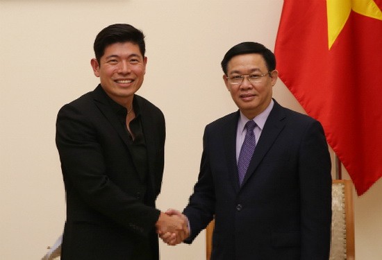 政府副總理王廷惠（右）接見Grab公司執行經理兼聯合創始人陳炳耀。（圖源：VGP）