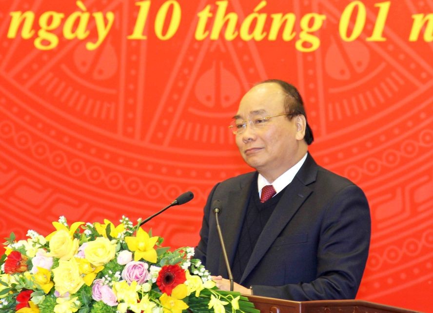 政府總理阮春福在會議上發表講話。（圖源：潘清）