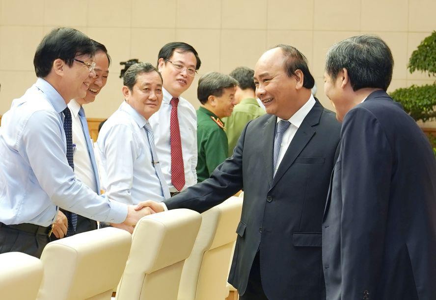 政府總理阮春福與新聞工作者交流。（圖源：光孝）