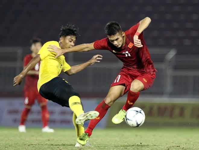 越南隊（紅衣）－馬來西亞隊比賽一瞥。（圖源：互聯網）