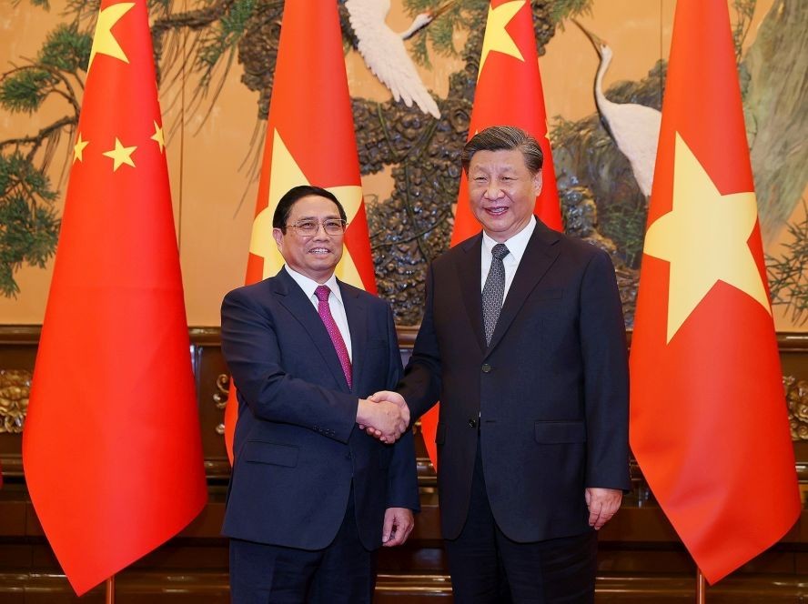 越南政府总理范明政会见中国共产党中央总书记、国家主席习近平。（图：越通社）