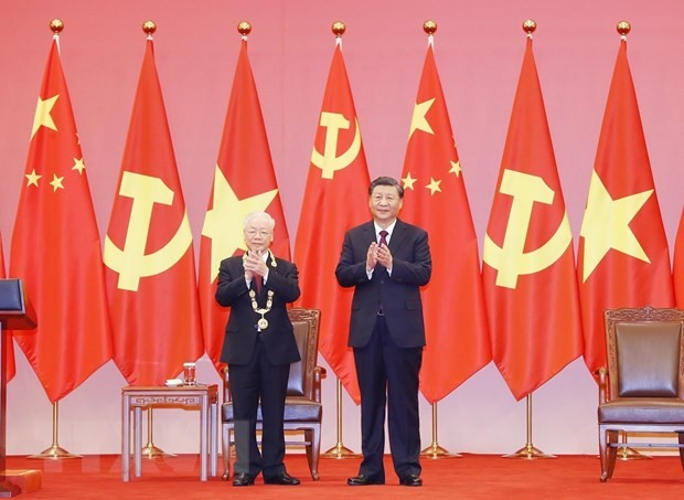 越南共产党中央总书记阮富仲与中共中央总书记、国家主席习近平。（图：越通社）